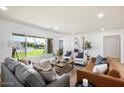 Bright and airy living room with large windows and comfortable seating at 5558 E Lafayette Blvd, Phoenix, AZ 85018