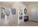 Bright hallway with tile flooring, leading to living room and bedroom at 4809 E Fire Opal Ln, San Tan Valley, AZ 85143