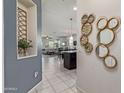 Open concept hallway with views into the living room and kitchen at 4809 E Fire Opal Ln, San Tan Valley, AZ 85143