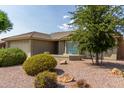 Front yard with two-car garage and desert landscaping at 10908 E Olla Ave, Mesa, AZ 85212