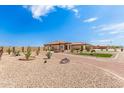 Landscaped front yard with desert plants and gravel at 6786 W Gelding Ln, Coolidge, AZ 85128