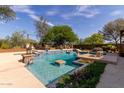 Inviting swimming pool with tiled accents and landscaping at 31811 N 16Th Ave, Phoenix, AZ 85085