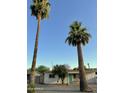 Charming Ranch home with a teal front door and a large yard at 2057 E Howe Ave, Tempe, AZ 85281