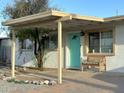 Cute ranch house with light teal front door and covered porch at 2057 E Howe Ave, Tempe, AZ 85281