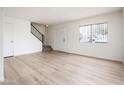 Spacious living area with light floors and stairs at 4015 S 45Th St, Phoenix, AZ 85040