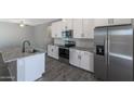 Modern kitchen with stainless steel appliances and granite countertops at 10347 N 115Th Ave, Youngtown, AZ 85363
