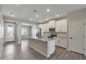 Modern kitchen with granite countertops and stainless steel appliances at 11507 W Deanne Dr, Youngtown, AZ 85363