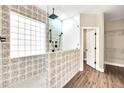 Updated bathroom with a walk-in shower and patterned tile at 654 S Sabrina --, Mesa, AZ 85208
