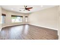 Bright living room with large windows and wood-look flooring at 654 S Sabrina --, Mesa, AZ 85208