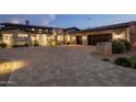 Elegant home with stone accents and a large driveway at 10867 E Laurel Ln, Scottsdale, AZ 85259