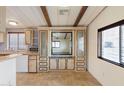 Kitchen with built-in cabinetry, microwave, and a large mirror at 3330 E Main St # 440, Mesa, AZ 85213