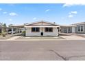 Front view of a manufactured home with a carport and walkway at 3330 E Main St # 440, Mesa, AZ 85213