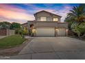 Two-story house with a three-car garage and a nicely landscaped yard at 21723 N 67Th Dr, Glendale, AZ 85308