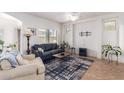 Comfortable living room with neutral tile floors and fireplace at 1560 E Melrose Dr, Casa Grande, AZ 85122