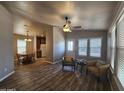Bright and airy living area with tile floors and a ceiling fan at 650 N Hawes Rd # 3404, Mesa, AZ 85207