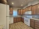 Spacious kitchen featuring wood cabinets and tile floors at 650 N Hawes Rd # 3404, Mesa, AZ 85207