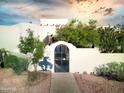 Ornate entry gate to a Southwestern style home at 19950 W Cambridge Ave, Buckeye, AZ 85396