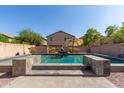 Inviting rectangular pool with a water feature and stone coping at 2527 W Brookhart Way, Phoenix, AZ 85085