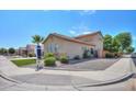 Two-story house with a tan exterior and lush landscaping at 1121 E Jahns Dr, Casa Grande, AZ 85122