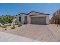 Charming curb appeal with a two-car garage and well-maintained yard at 1767 W Hopi Dr, Coolidge, AZ 85128