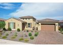 Tan two-story house with garage at 15175 S 185Th Ave, Goodyear, AZ 85338