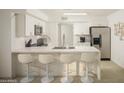 Modern kitchen with breakfast bar and stainless steel appliances at 5818 N Granite Reef Rd, Scottsdale, AZ 85250
