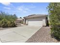 House exterior featuring a driveway and desert landscaping at 13164 W Ocotillo Ln, Surprise, AZ 85374