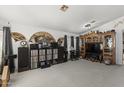 Spacious living room with built-in entertainment center and carpeting at 13164 W Ocotillo Ln, Surprise, AZ 85374