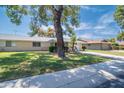 Ranch home with large tree and spacious yard at 15630 N Lakeforest Dr, Sun City, AZ 85351