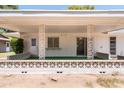 Covered patio with decorative block wall and sliding glass door at 15630 N Lakeforest Dr, Sun City, AZ 85351