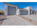 Modern house exterior with a gray gravel driveway at 19998 W Luke Ave, Litchfield Park, AZ 85340