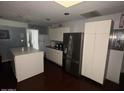 Modern kitchen with stainless steel appliances and island at 1517 W Sahuaro Dr, Phoenix, AZ 85029