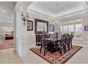 Elegant dining room with a large table and chandelier at 15819 W Silver Breeze Dr, Surprise, AZ 85374