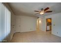 Bright living room with tile floors and ceiling fan at 15444 N 23Rd St, Phoenix, AZ 85022