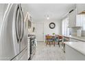 Modern kitchen featuring stainless steel appliances and light wood-toned flooring at 7215 N 21St Dr, Phoenix, AZ 85021