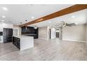 Modern kitchen with large island, marble countertops, and dark cabinetry at 1236 E Mclellan Blvd, Phoenix, AZ 85014
