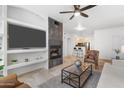 Bright living area with a fireplace and open concept to kitchen at 6900 E Princess Dr # 2221, Phoenix, AZ 85054