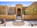 Spanish style home with gated entry and landscaped desert front yard at 323 W Quartz Rock Rd, Phoenix, AZ 85085