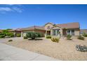 One-story house with a two-car garage and nicely landscaped yard at 18000 N Estrella Vista Dr, Surprise, AZ 85374