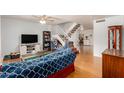 Living room with hardwood floors, staircase, and built-in shelving at 2051 W Elm St, Phoenix, AZ 85015