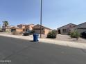 Exterior view of house from across the street at 22005 W Cocopah St, Buckeye, AZ 85326
