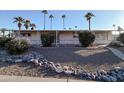 Front view of a manufactured home with palm trees and rock landscaping at 120 N Val Vista Dr # 264, Mesa, AZ 85213