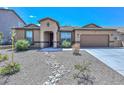 Tan house with a landscaped front yard and a rock pathway at 10773 W Swayback W Pass, Peoria, AZ 85383