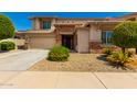 Two-story house with stone accents and landscaping at 18182 W Young St, Surprise, AZ 85388