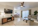 Open living room with sectional sofa, dining area, and kitchen at 3500 N Hayden Rd # 1005, Scottsdale, AZ 85251
