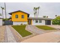 Mid-century modern home with landscaped yard at 8608 E Angus Dr, Scottsdale, AZ 85251
