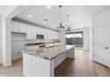 Modern kitchen featuring granite countertops and stainless steel appliances at 21451 W Palm Ln, Buckeye, AZ 85396