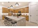 Modern kitchen with island and stainless steel appliances at 22511 E Saddle Ct, Queen Creek, AZ 85142
