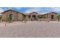 Stone house with a large front yard and gated entry at 35140 N 52Nd Pl, Cave Creek, AZ 85331