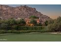 Stunning property nestled by a lake and mountain backdrop at 27050 N 103Rd St, Scottsdale, AZ 85262